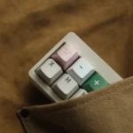 Detailed views of the handcrafted aluminum alloy Artisan Pig Keycap, showing its whimsical design and lustrous metallic finish from various angles.