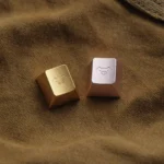 Close-up of a whimsical handcrafted aluminum alloy Artisan Pig Keycap, showcasing its lustrous metallic finish and intricate design, a premium charm design.