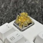 Detailed view of the artistic gold-plated pure copper artisan rose keycap, featuring its intricate traditional Chinese design and opulent metallic fiinish.
