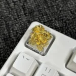 Artistic gold-plated pure copper artisan rose keycap, intricately designed with a traditional Chinese aesthetic, shown from various angles for a detailed.