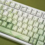 Close-up of the artistic Bamboo PBT Keycaps Set, showcasing the serene minimalist bamboo forest motif and elegant green hues, perfect for a tranquil nature.