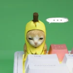 Adorable handcrafted Banana Cat Keycap for custom keyboards, a joyful artisan ESC key featuring a charming feline with a whimsical banana motif.
