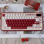 Vibrant red Berry Box PBT Dye-Sub Keycap Set, featuring playful strawberry and box motifs. It highlights the original height and charming aesthetics.