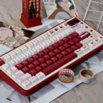 Charming Berry keycap set with vibrant red PBT dye-sub designs and playful box motifs for a delightful keyboard aesthetic.
