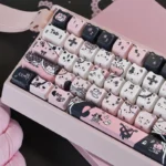 Exquisite black cat artisan PBT keycap set, viewed from a striking angle, highlighting its sleek, mysterious silhouette for elegant keyboard customization.