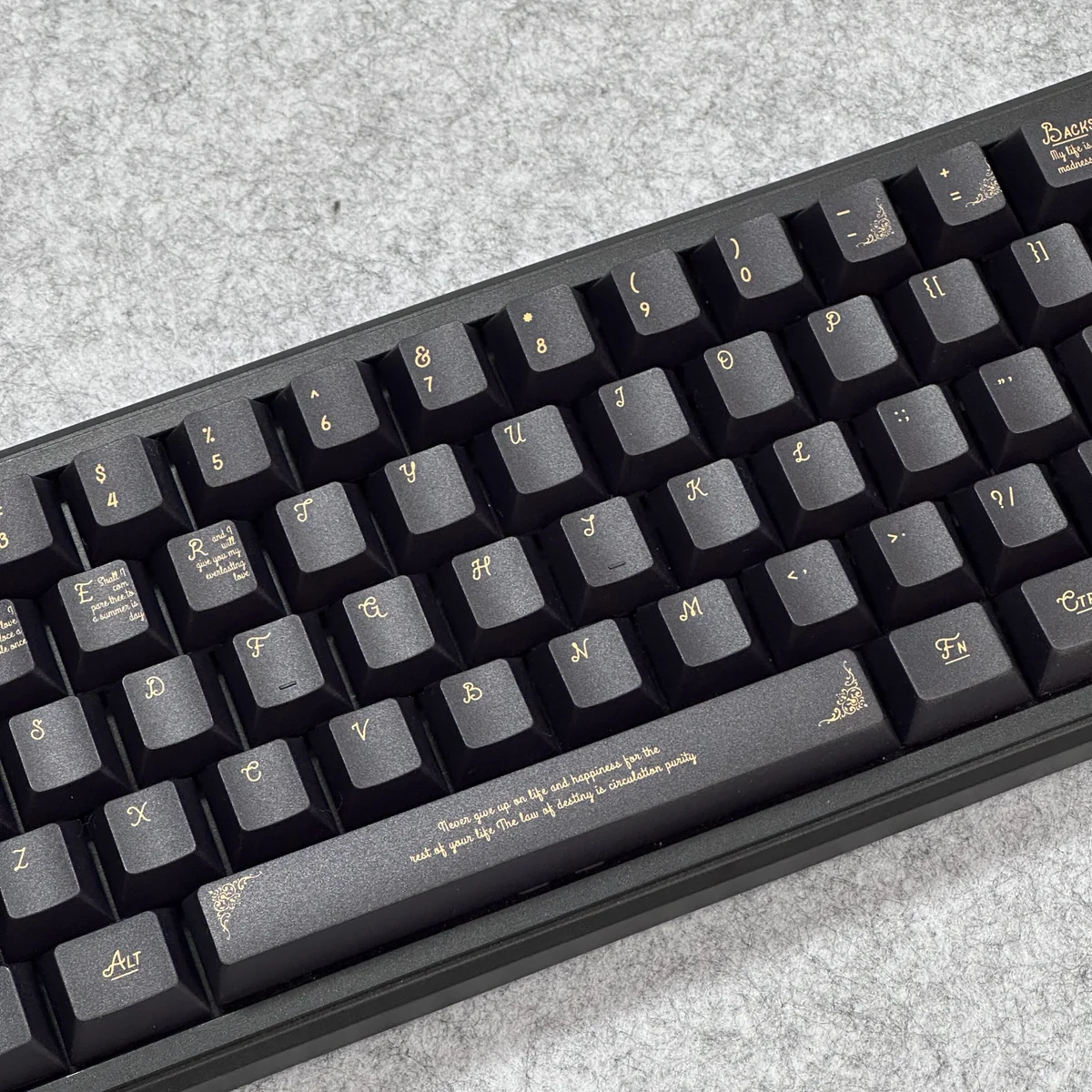 A detailed view of the Ornate Black Gold Baroque PBT Keycaps Set, highlighting intricate classical gold patterns on luxurious black keycaps from various angles.