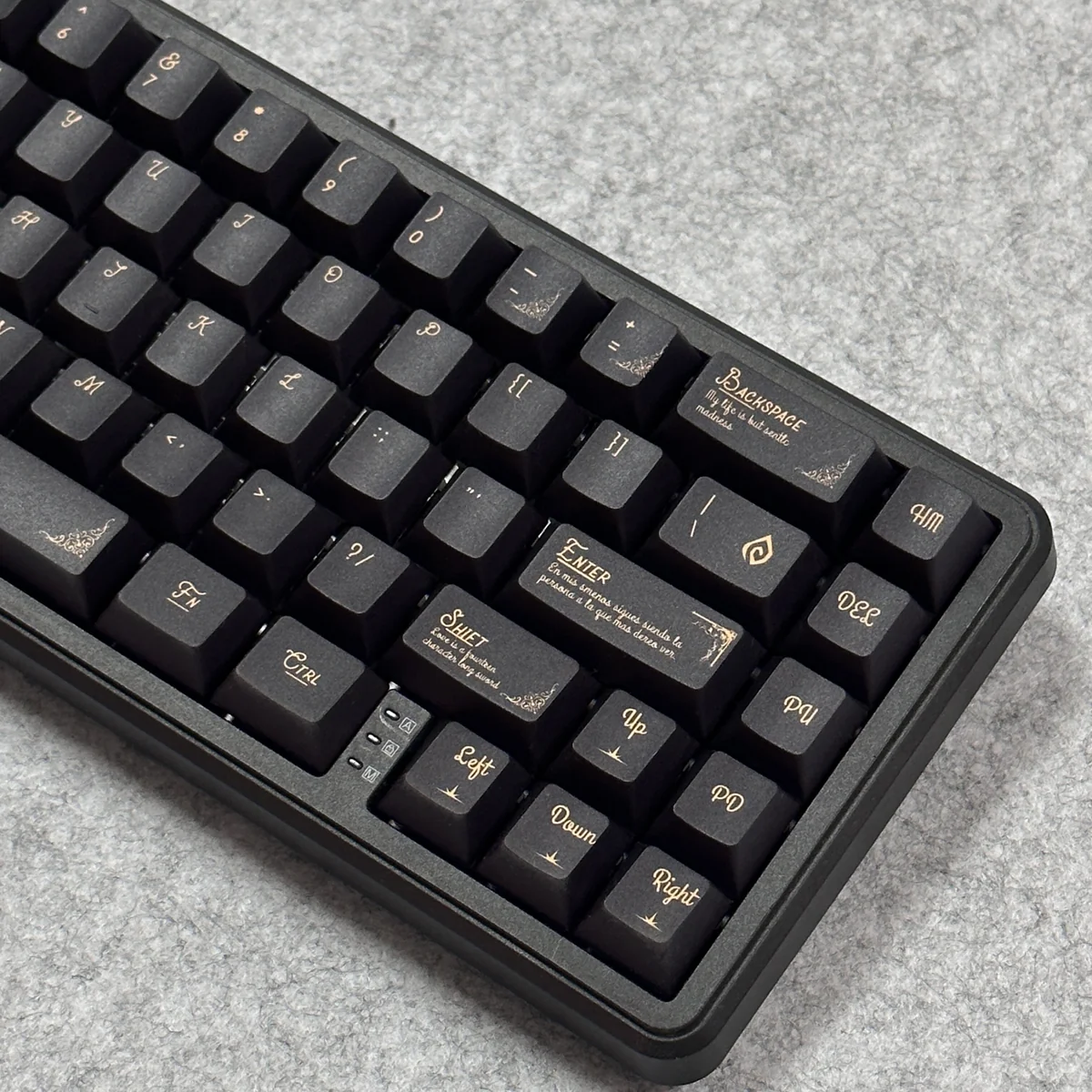 A close-up view of the ornate black and gold Baroque PBT keycaps set, showcasing intricate classical motifs and luxurious details from a unique angle.