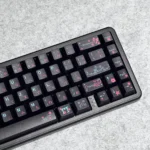 Serene black Japanese PBT dye-sublimated keycap set, shown from multiple angles, highlighting durable PBT, elegant natural motifs, and legends.