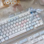 Immersive Blue Rain PBT keycaps set, shown from multiple angles in this product gallery. Deep blues and rain motifs create a serene desktop ambiance.