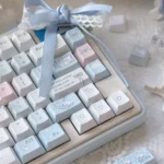 Close-up of the Immersive Blue Rain PBT Keycap Set, highlighting its deep blue hues and subtle rain motifs from various artistic angles.