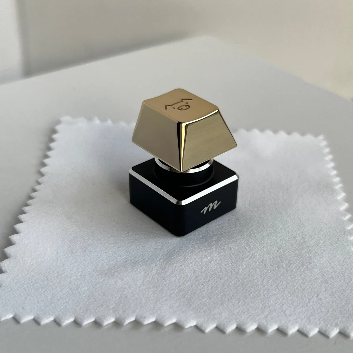 Handcrafted solid brass pig keycap from various angles, showcasing its warm golden luster and meticulous sculpting. A premium lucky charm for your keyboard.