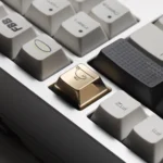 Gallery of handcrafted brass whale ESC keycaps, showcasing the mirror-polished luxury and intricate artistry from multiple angles. A premium accessorries.