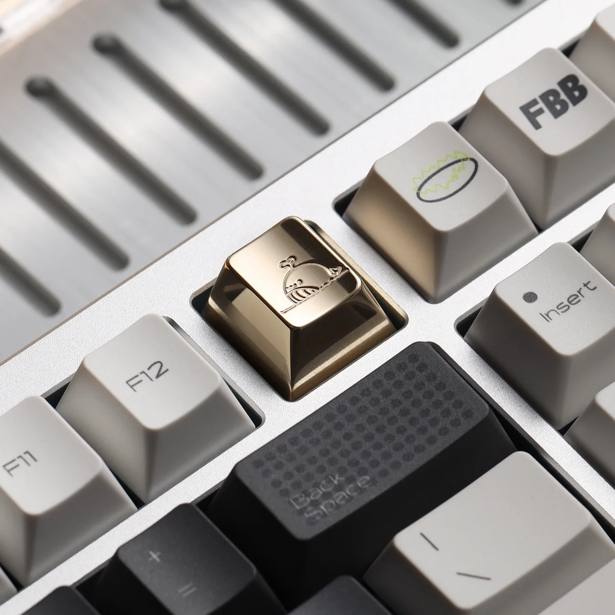 A stunning handcrafted brass whale keycap, mirror-polished to a luxurious shine, showcasing intricate detail for a premium desktop aesthetic.