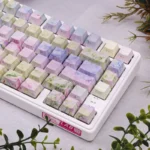 Artistic Spring Breeze Side-Lit PBT Keycaps Set, showcasing a detailed angle of their soft, impressionistic spring landscapes and tranquil floral motif.