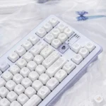 Adorable PBT dye-sub MOA Bunny Dessert keycaps set, featuring whimsical pastel bunnies and sweet treats. A charming angle for a playful desk setup.