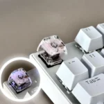 Nature's Bloom Butterfly Transparent Keycaps, showcasing delicate nature-inspired designs embedded in vibrant resin. Viewed from multiple artisan angles.