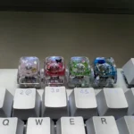 Nature's Bloom Butterfly Transparent Keycaps showcasing delicate nature's bloom designs embedded in crystal-clear resin, a vibrant and unique keyboard accent.