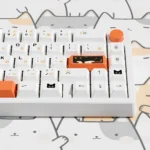 A playful gallery showcasing the vibrant Calico Cat PBT Dye-Sub Keycap Set for keyboards, highlighting adorable cat illustrations from multiple angles.