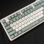 Durable PBT Camellia keycaps set with exquisite dye-sublimated floral art, shown from multiple angles. Ideal for elegant keyboard personalization.