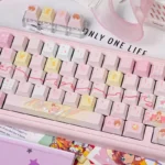 Close-up of the exclusive Cardcaptor Sakura keycap set, showcasing its whimsical, vibrant anime design from a unique angle. A magical charm for your keyboard.