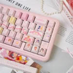Exclusive Cardcaptor Sakura keycap set, shown from various angles, highlighting its whimsical, vibrant design and magical anime aesthetic for keyboard aesthetics.