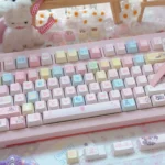 A vibrant Cardcaptor Sakura PBT keycap set displayed from a captivating angle, showcasing detailed anime characters and magical pastel symbols.