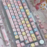 Detailed shot of the complete Cardcaptor Sakura PBT keycap set, featuring vibrant anime characters, magical symbols, and enchanting pastel colors.