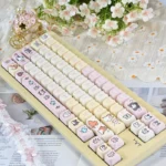 Close-up of an adorable Hachimi pixel cat head PBT keycap set, showcasing whimsical retro charm and vibrant colors, perfect for backlit keyboards.