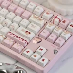 Cherry Cake PBT keycaps set from a charming new angle, revealing playful pastel pinks, sweet cherry, and cake motifs. Enjoy durable PBT whimsy.