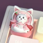 Unique angle of the whimsical handcrafted Chiikawa Cat Ear Cradle keycap, showcasing the adorable Chiikawa character nestled in its cozy cradle design.