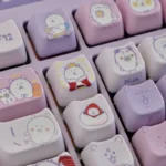 Playful Chiikawa keycaps in a vibrant purple-white gradient PBT set, showcasing charming characters and the unique MAO profile from multiple angles.