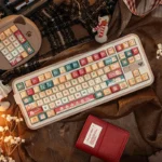 Adorable Christmas cat PBT keycaps set displayed from various angles, highlighting whimsical holiday cat illustrations and cozy festive colors for a cheerful setup.