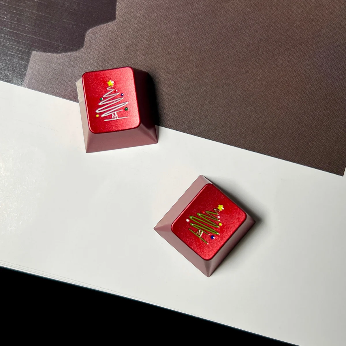 Premium CNC Aluminum Christmas Tree Keycap. Intricate metallic Christmas tree and delicate snowflakes are visible from multiple angles.