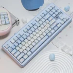 Dreamy Cinnamoroll PBT MOA Keycap Set shown from playful angles, highlighting pastel Cinnamoroll and cloud motifs for a serene desktop aesthetic.