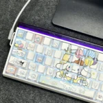 Close-up of adorable Cinnamoroll side-lit PBT keycaps set, showcasing sweet character art and luminous legends for a charming, playful keyboard aesthetic.