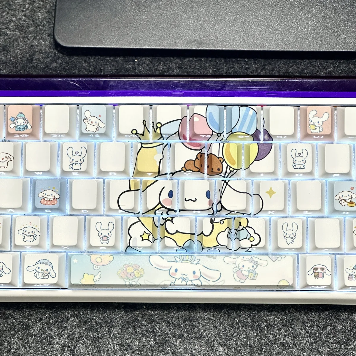 A gallery of Cinnamoroll side-lit PBT keycaps set, highlighting adorable character art, pastel colors, and durable glowing legends from various angles.