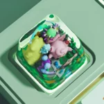 Whimsical handcrafted pastel pink Clefairy keycap from multiple angles, highlighting its miniature details and charming Pokemon design.