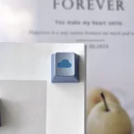 Premium CNC aluminum Ethereal Cloud Artisan Keycap. Serene cloud design, polished finish, precise R4 form. Exemplifies minimalist artistry.