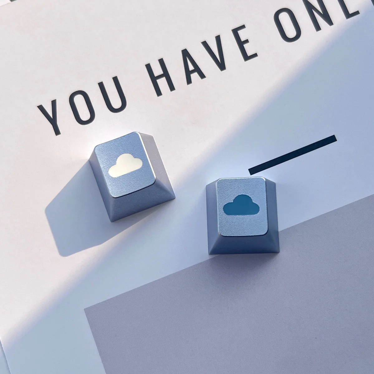 Ethereal cloud artisan keycap crafted from premium CNC aluminum, showcasing a polished R4 profile and serene, minimalist design.