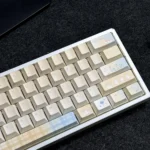 Ethereal Cloud Floral PBT Dye-Sub Keycap Set displayed from various angles, highlighting its whimsical garden design, serene colors, and artistic details.