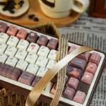 Serene Coffee PBT Keycaps Set gallery shot. Warm, inviting coffee palette. Durable, dye-sublimated PBT keycaps add sophisticated cafe ambiance to your desk.