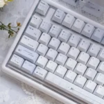 Confession Keycaps Set: Romantic pastel PBT dye-sublimated set. Gallery views showcase soft hues, gentle minimalist design, evoking subtle romance.