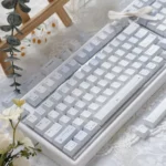 Confession Keycaps Set: Romantic pastel PBT dye-sublimated keycap set, showcasing delicate hues and a gentle, artistic minimalist design.