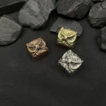 Mystical handcrafted pure copper owl artisan keycap, intricately detailed and showcasing its vintage fantasy aesthetic from multiple enchanting angle.