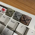 A mystical handcrafted pure copper owl artisan keycap, intricately detailed, evoking a magical vintage fantasy for enchanted keyboards.