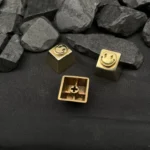 Multiple angles showcase the premium pure copper smiley keycap, gleaming with handcrafted artisan texture for mechanical keyboards, capturing its playful design.
