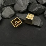 A captivating angle of the premium pure copper smiley keycap for mechanical keyboards, revealing its gleaming artisan handcrafted texture and playful setup.