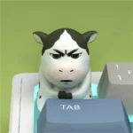 Close-up of a Iconic Cow Emoji Keycap, showcasing its playful ox design and whimsical charm for unique desks.