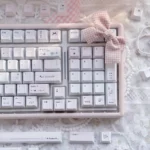 Artistic close-up of Crush PBT Keycaps Set, revealing their soft, ethereal color palette and romantic motifs. Emphasizes the durable PBT elegance and dreaming design.