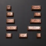 An artisan Cthulhu Mythos pure copper keycap set, showcasing its intricate dark fantasy Lovecraftian motifs and vintage aesthetic from a detailed angle.